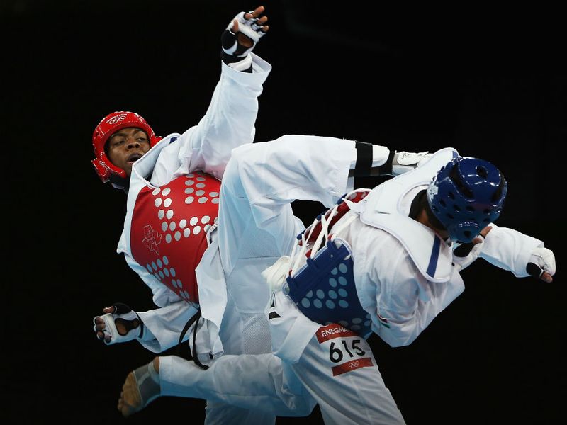 Lutalo Muhammad of Team GB takes on Tajikistan's Farkhod Negmatov, putting the difficult build-up to these Games behind him.