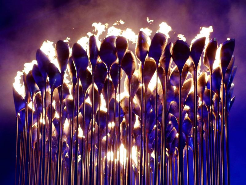 The Olympic Flame is extinguished and the Games are officially over, while The Who send the crowd home singing