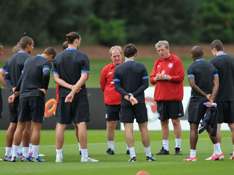 Roy Hodgson addresses Andy Carroll, Leighton Baines and the rest of his England charges as Ray Lewington looks on.