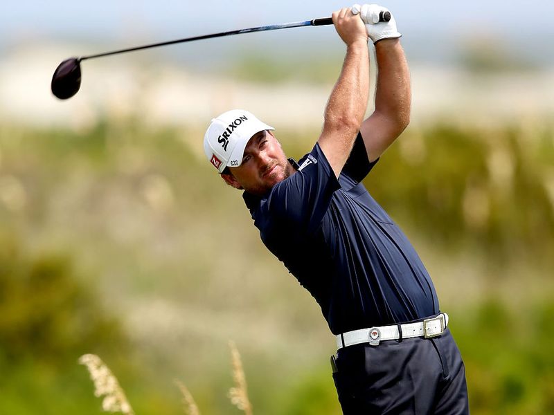 Graeme McDowell put himself in contention at a major once again as he also shot 68.