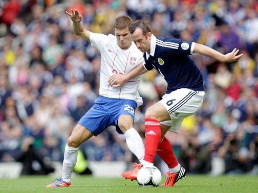 Lazovic and Adam battle for the ball.