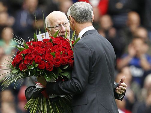 Sir Bobby Charlton presented Ian Rush with flowers