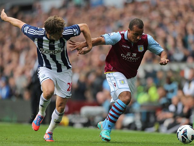 Agbonlahor tries to run away from Jones.