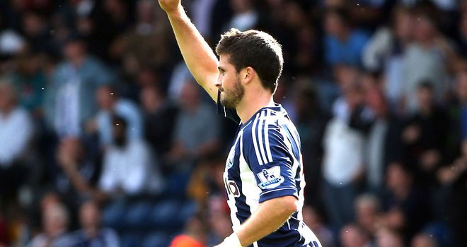 Shane Long: Celebrates his goal and his new manager at the Hawthorns on Saturday