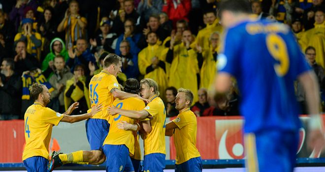 Sweden celebrate Rasmus Elm's goal.