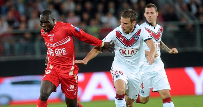 Vincent Aboubakar and Gregory Sertic battle for the ball