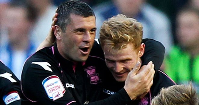 Burke: Celebrates his goal with Robinson