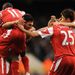 Bobby Zamora is mobbed after giving QPR the lead at former side Tottenham