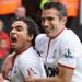 Manchester United's two goalscorers celebrate during a 2-1 victory over Liverpool