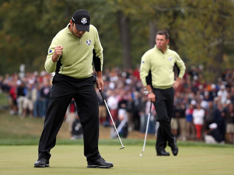 Francesco Molinari sinks a putt which puts him and Westwood 1up against Dufner and Johnson.