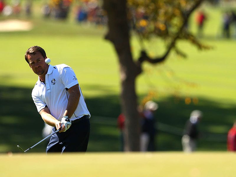 Ryder Cup hero from 2010 Graeme McDowell endures an awful start and falls behind to Zach Johnson.