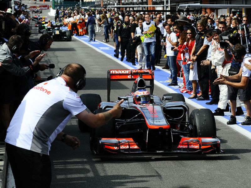 The race winner is welcomed back into the pit lane