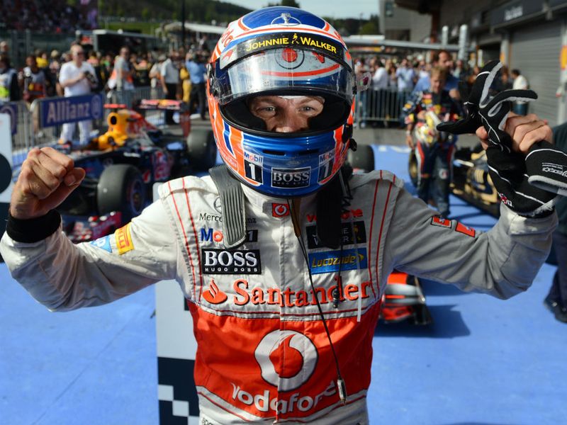 Button celebrates in parc ferme