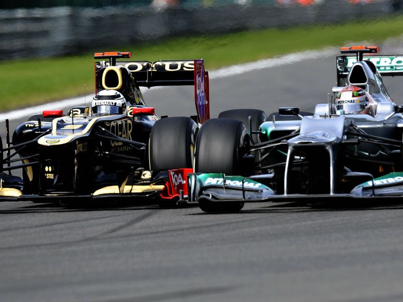 Kimi Raikkonen and Michael Schumacher go wheel to wheel