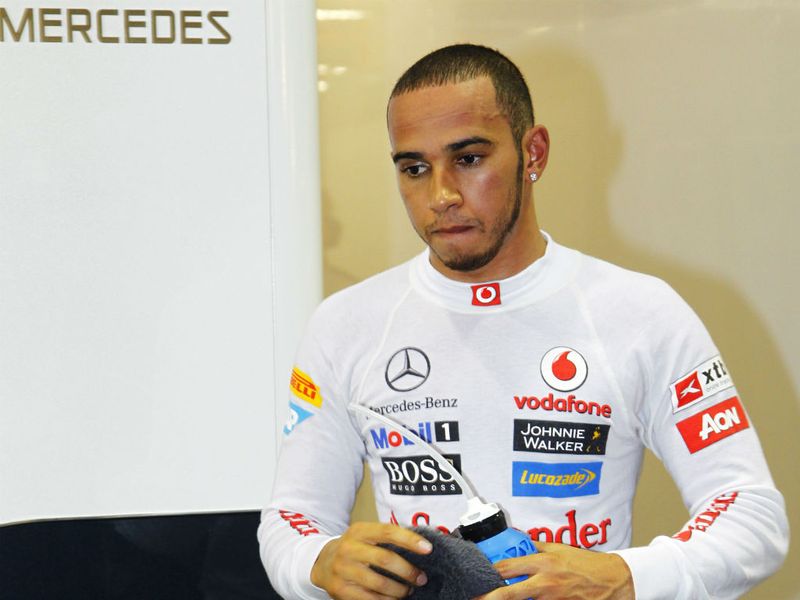 A frustrated Hamilton returns to the McLaren garage