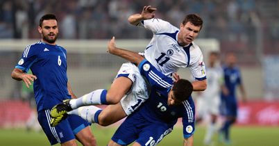 Dzeko double helps sink Greece