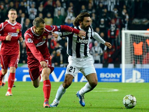 Andrea Pirlo holds off Nicolai Stokholm