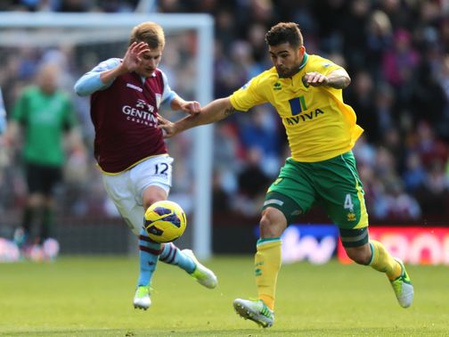 Albrighton and Johnson chase the ball.