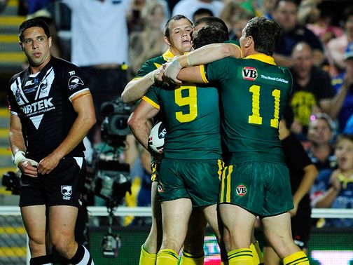 Cameron Smith is mobbed after his try