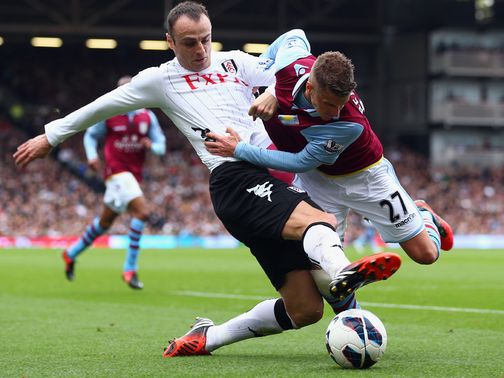 Dimitar Berbatov tackles Joe Bennett
