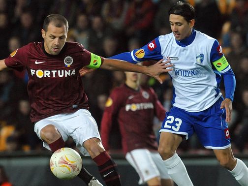 Marek Matejovsky battles with Adrian Rochet