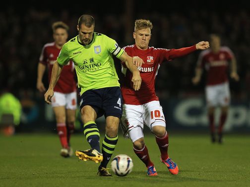 Matt Ritchie tries to challenge Ron Vlaar