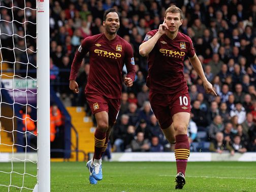Two-goal Edin Dzeko celebrates at The Hawthorns