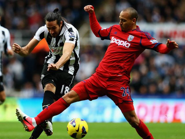 Jonas Gutierrez gets a shot in on goal.