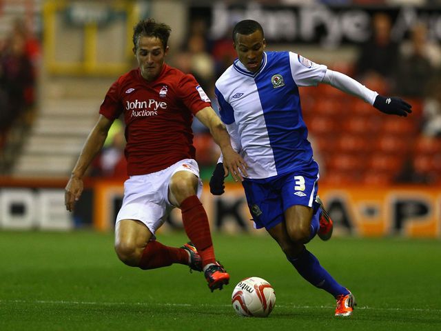 Chris Cohen and Martin Olsson battle for the ball
