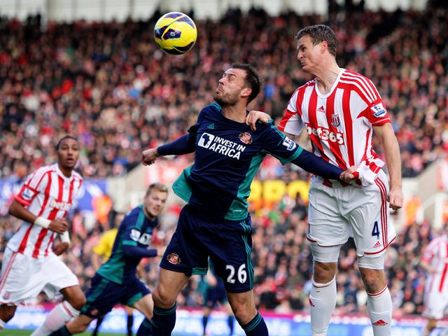 Fletcher and Huth go up for a header.