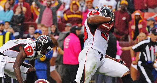 Michael Turner runs through to score his winning touchdown