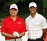 Tiger Woods with the Malaysian Prime Minister during a practice round