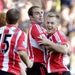 Sunderland's players celebrate as they avoid defeat against their arch-rivals