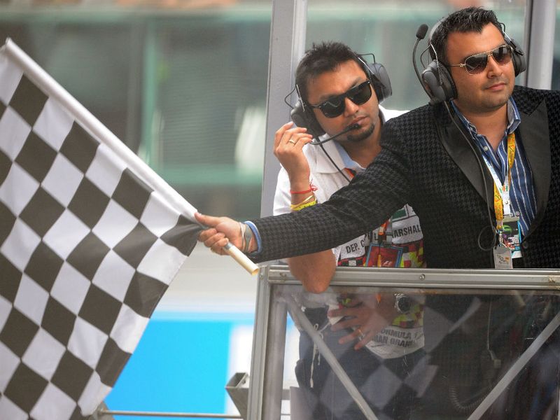India's Olympics bronze medallist Gagan Narang waves the checkered flag