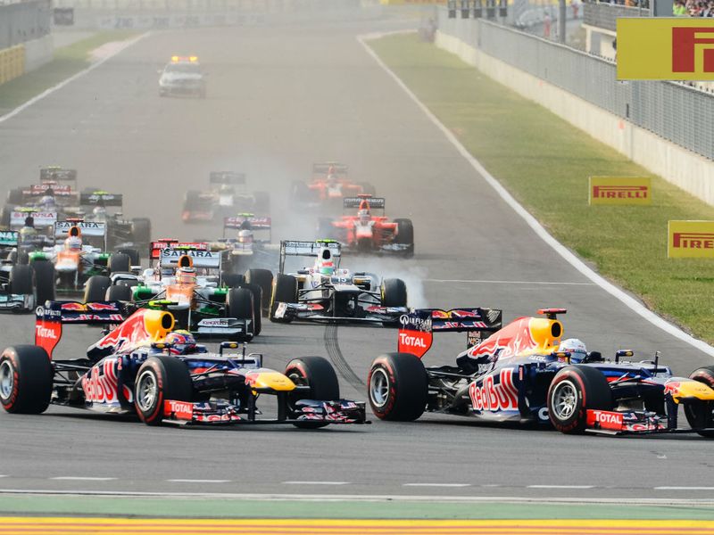 Things get tight at turn one as Perez dives down the inside with brakes locked