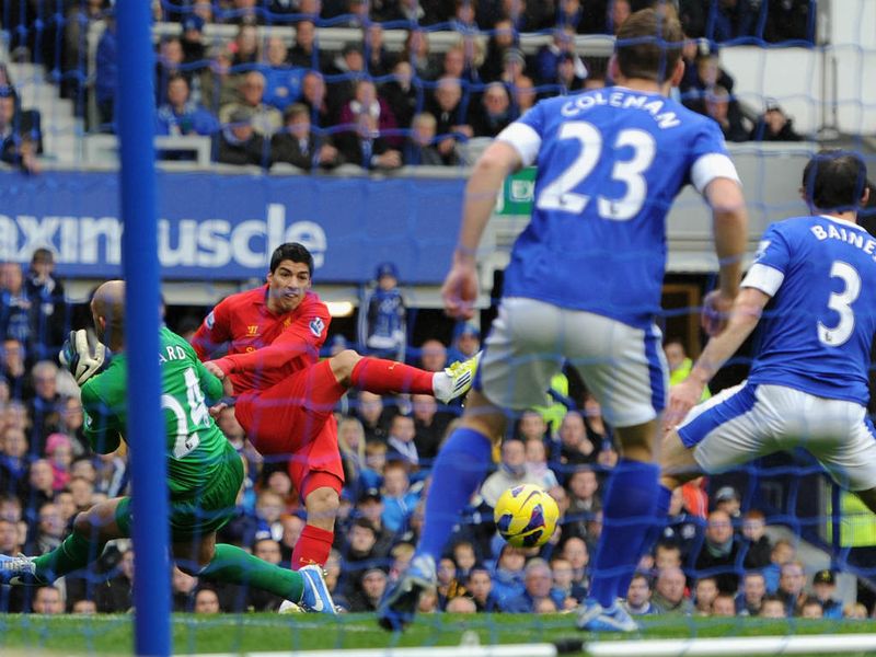 Luiz Suarez's deflected effort put Liverpool into the lead during the Merseyside derby against Everton