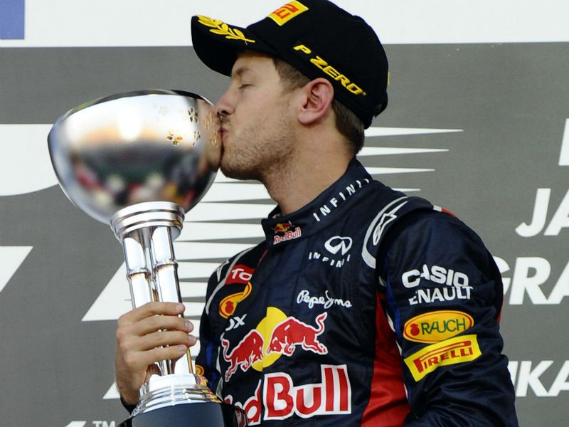 Vettel kisses his trophy