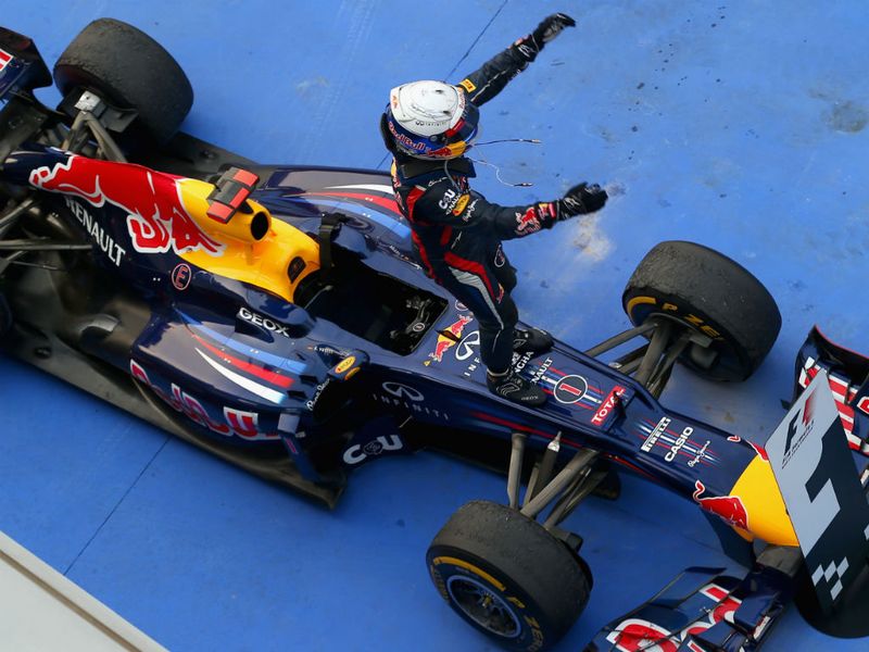 Vettel celebrates in parc ferme