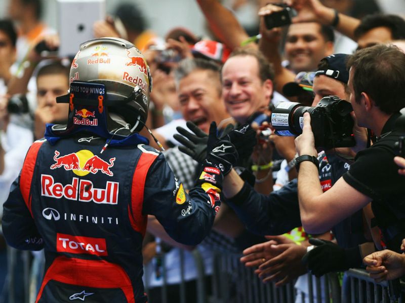 The race winner is welcomed to parc ferme