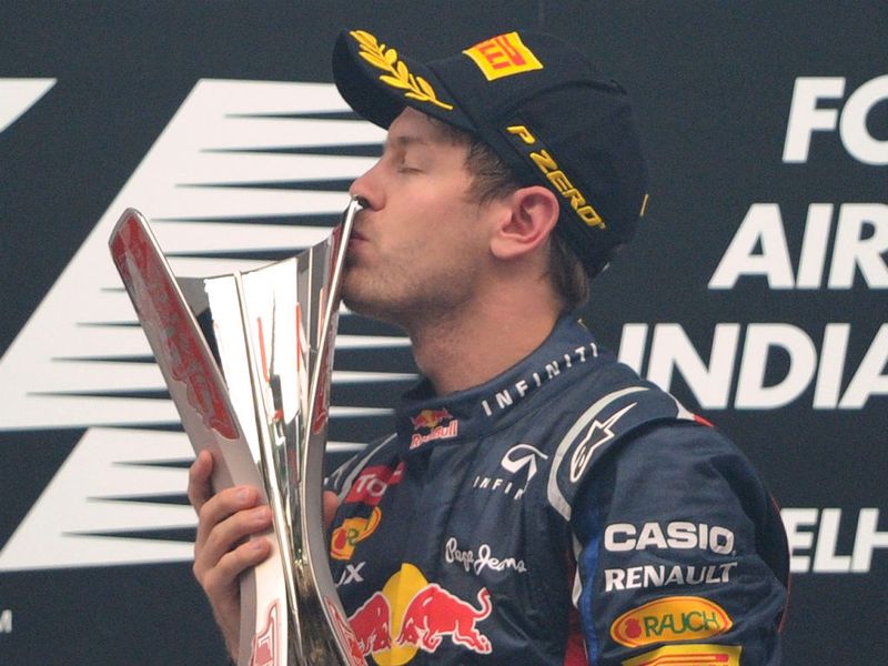 The winner kisses his trophy