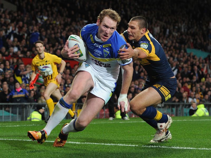 Joel Monaghan evades the challenge of Ryan Hall to score Warrington's second try to ensure the scores are level at 14-14 at half-time