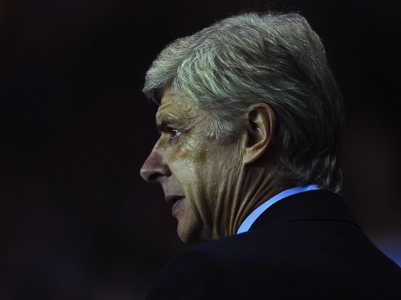 Gunners boss Arsene Wenger looks on as his side slip 4-1 behind to Reading by the break.
