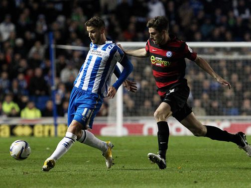 Andrea Orlandi and Shaun Brisley battle for the ball
