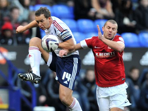 Kevin Davies and Stephen Dawson battle for the ball
