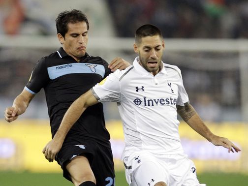 Cristian Ledesma and Clint Dempsey battle for the ball