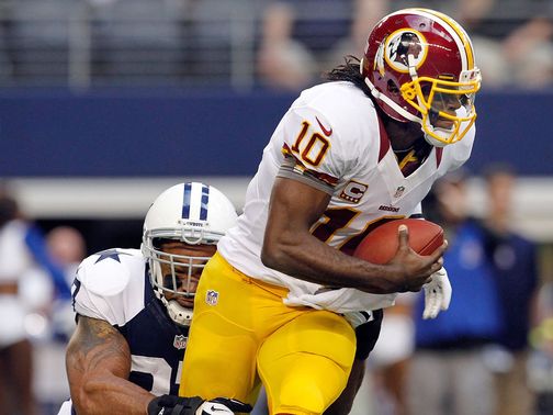 Robert Griffin III escapes the attention of Jason Hatcher