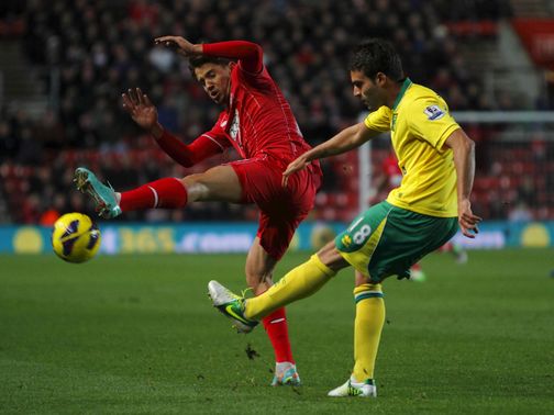 Gaston Ramirez blocks a cross from Javier Garrido