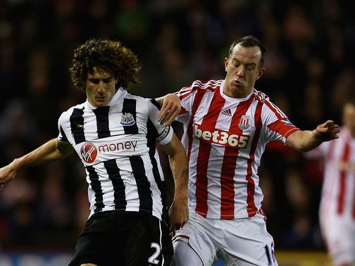 Fabricio Coloccini and Charlie Adam battle for the ball