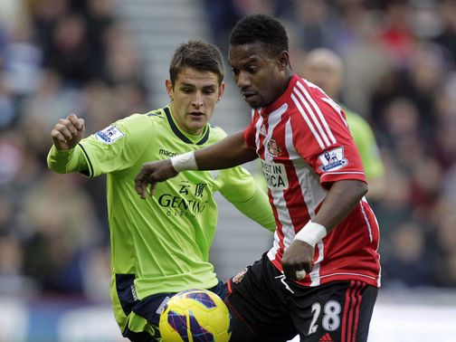 Westwood and Sessegnon battle for the ball