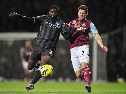 Kolo Toure and Matt Jarvis battle for the ball